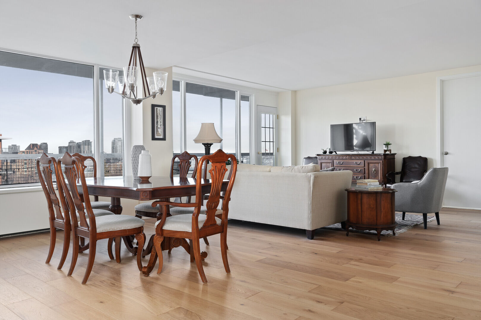 Open concept condo design with hardwood floors